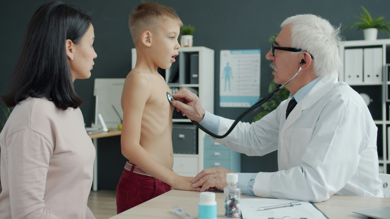 Doctor with child and mother